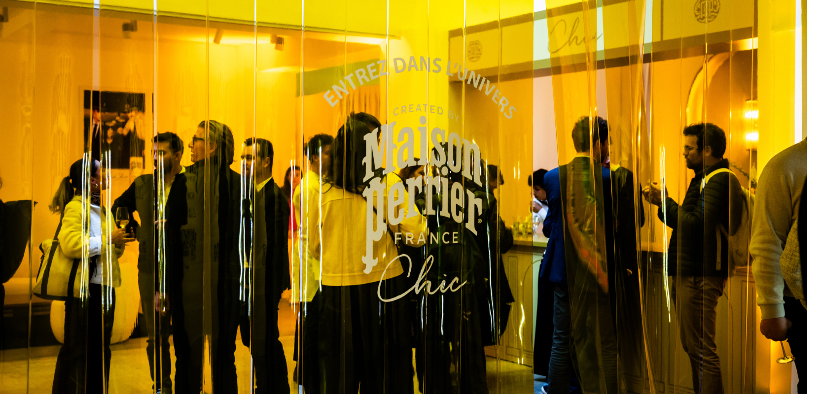 People socializing at Maison Perrier event